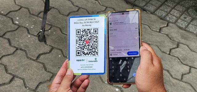 Nộp phạt giao thông qua QR tại chỗ, người dân TP.HCM khen tiện lợi- Ảnh 4.