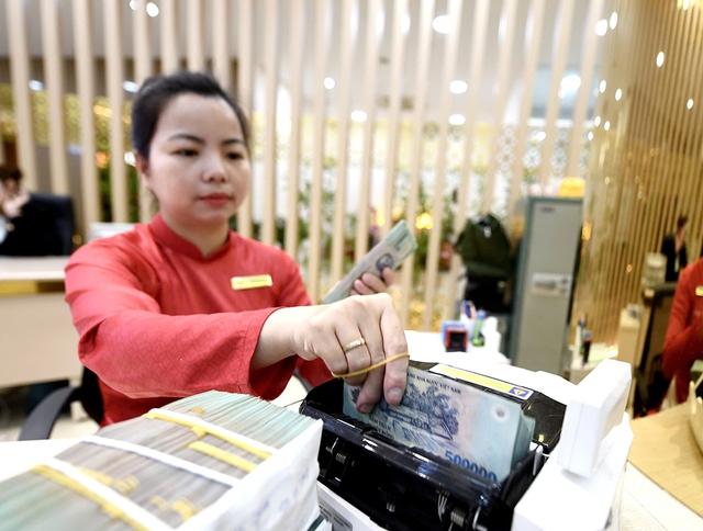 Huy động 'hụt hơi', lãi suất tăng- Ảnh 1.