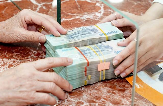 Lãi suất tiết kiệm tăng cao, gửi 500 triệu đồng sẽ được bao nhiêu? - Ảnh 1.