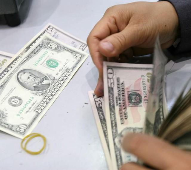 Giá USD hôm nay 21.12.2025: Đô tự do lao dốc xuống dưới 27.000 đồng - Ảnh 1.