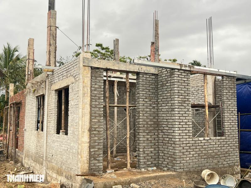 Bộ đội dầm mưa xây nhà cho dân kịp tết 2026 trong Chiến dịch Quang Trung - Ảnh 3. Bộ đội dầm mưa xây nhà cho dân kịp tết 2026 trong Chiến dịch Quang Trung - Ảnh 3.