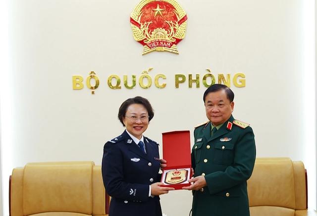 Thượng tướng Hoàng Xuân Chiến tiếp Tham tán Cảnh vụ Trung Quốc- Ảnh 1.