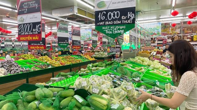 Hết tết, giá hàng hóa thiết yếu giảm nhẹ- Ảnh 1.