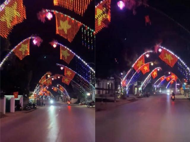 Đoạn đường dựng cây nêu, treo bóng nháy tạo hình cờ Việt Nam gây 'sốt' dịp tết - Ảnh 1.