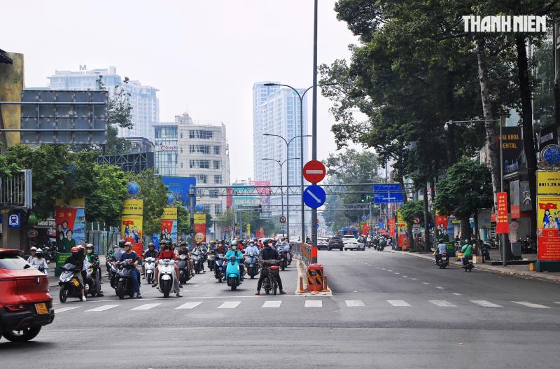 Hoàng hôn 28 tết trước ngày giao thừa: Đường phố trung tâm TP.HCM thật khác! - Ảnh 8.