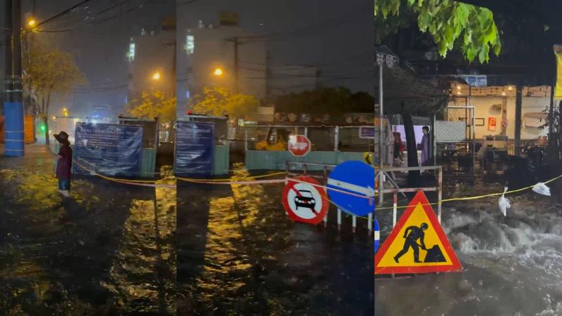 TP.HCM: Mưa lớn ngập đường, nước cuốn phăng rào chắn công trình ở Hóc Môn - Ảnh 1.