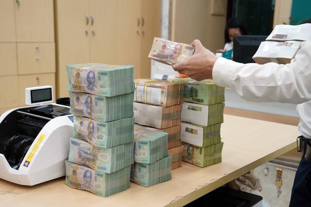Lãi suất tiền đồng liên ngân hàng tăng - Ảnh 1.
