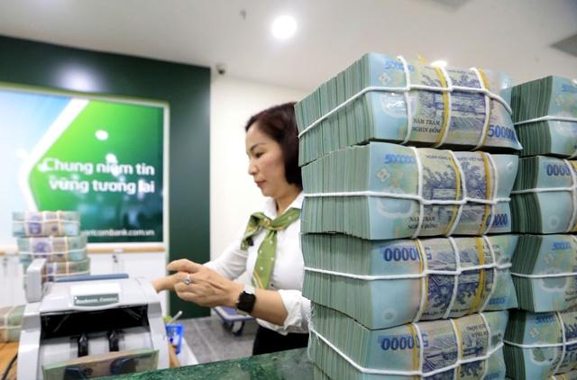 Người dân gửi tiền ngân hàng gia tăng tháng thứ 3 liên tiếp- Ảnh 1.